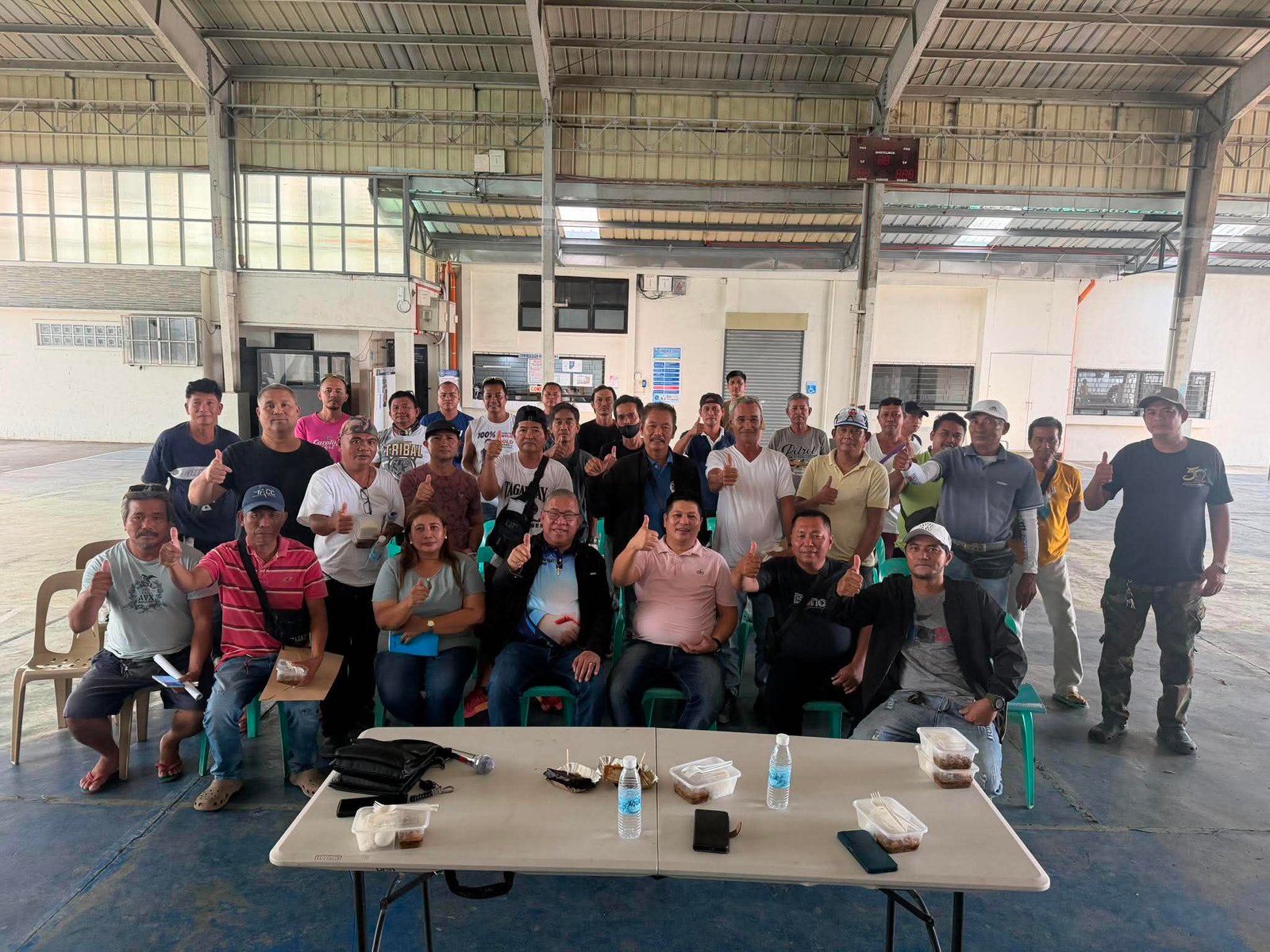 Jennyson with Para Tricycle App community partners